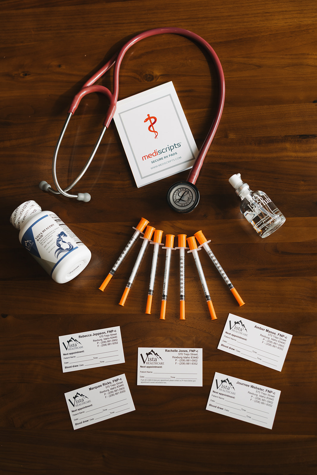 Medical tools including stethoscope, syringes, and prescription pad