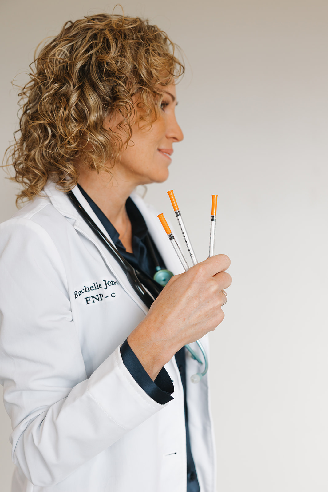 Rachelle Jones, FNP-C holding syringes